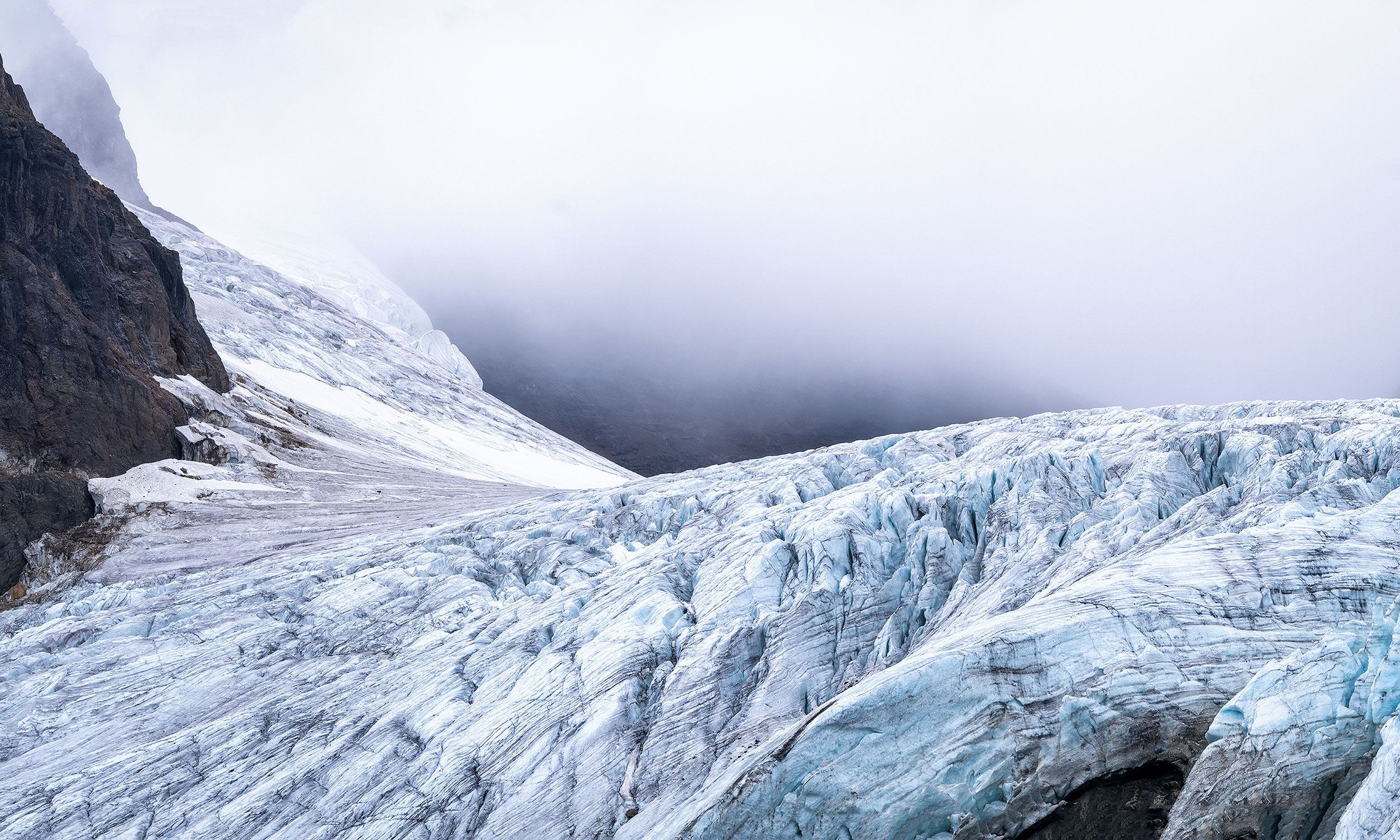Weather moving in over a glacier on the Svalbard archipelago in the Arctic ocean