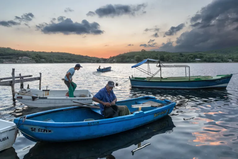 Granma Cay is a beautiful little fishing community in the entrance to the bay of Santiago de Cuba. The fishermen in this image are getting ready to head out to sea to fish all night…
