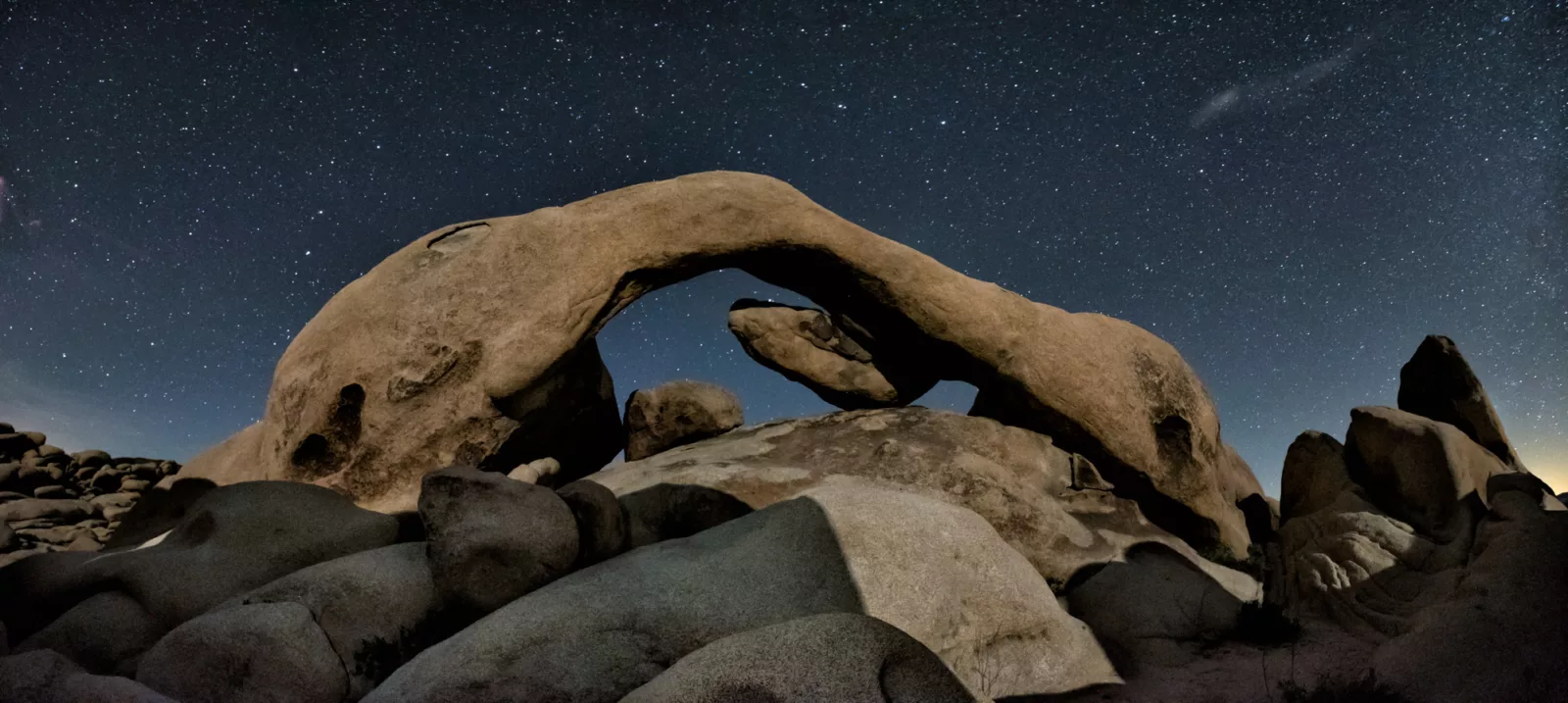 Clear starry night at Arch Rock - Joshua Tree National Park